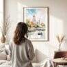 03 - Framed Bangkok Wat Arun Watercolor Wall Art - In Living Room with Woman Looking at it - Portrait